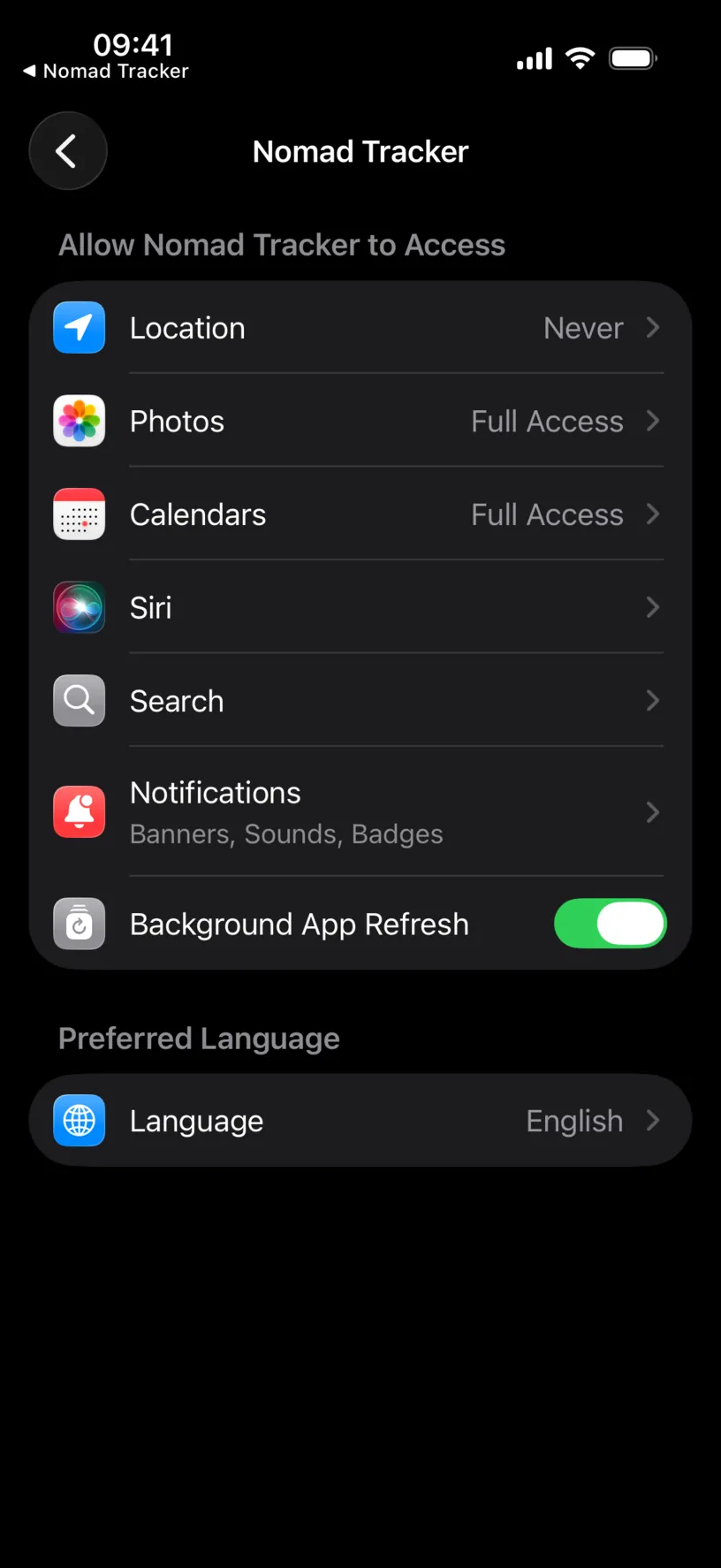 The iOS Settings page for Nomad Tracker, with Location set to Never and Background App Refresh on